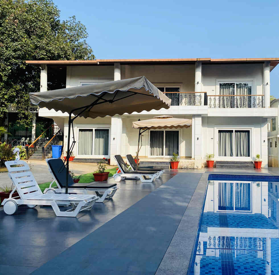 the resort in Karjat for family vacations, surrounded by lush greenery and scenic mountain views.